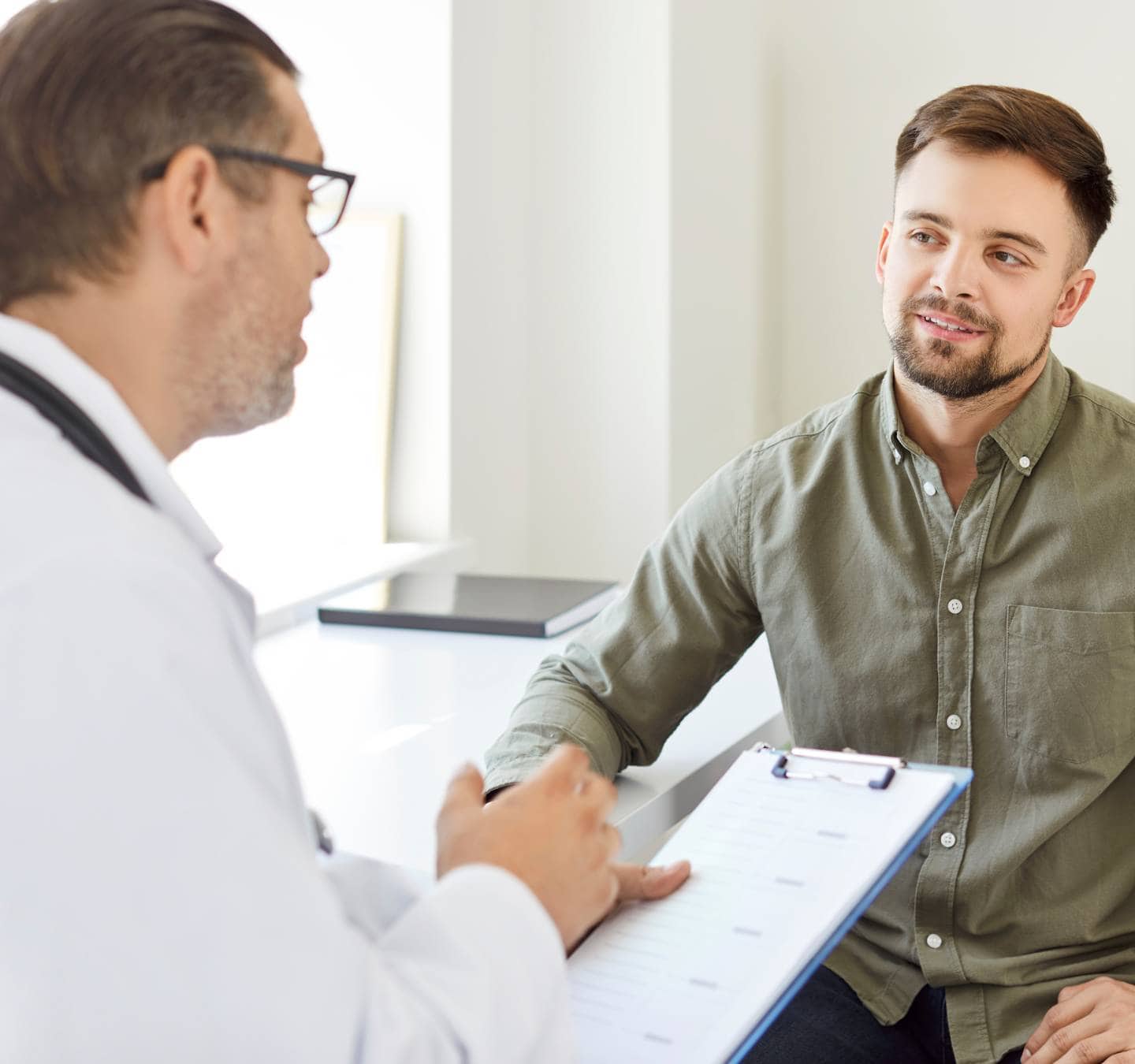 Man meeting with a healthcare provider during depression treatment in Massachusetts.