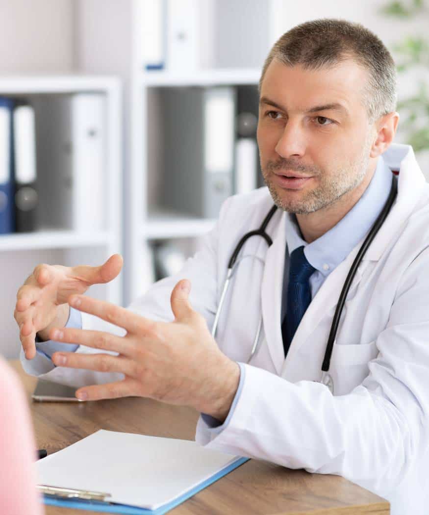 Doctor guiding a patient during a consultation for depression treatment in Massachusetts.