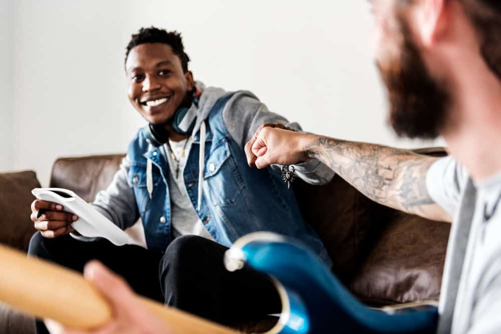 People fist bumping during addiction treatment in Brockton MA recovery support session