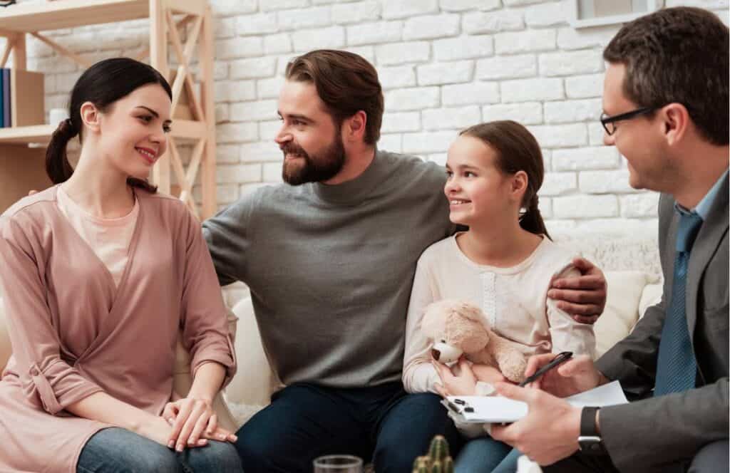 Family sharing a positive moment during family therapy in Massachusetts.