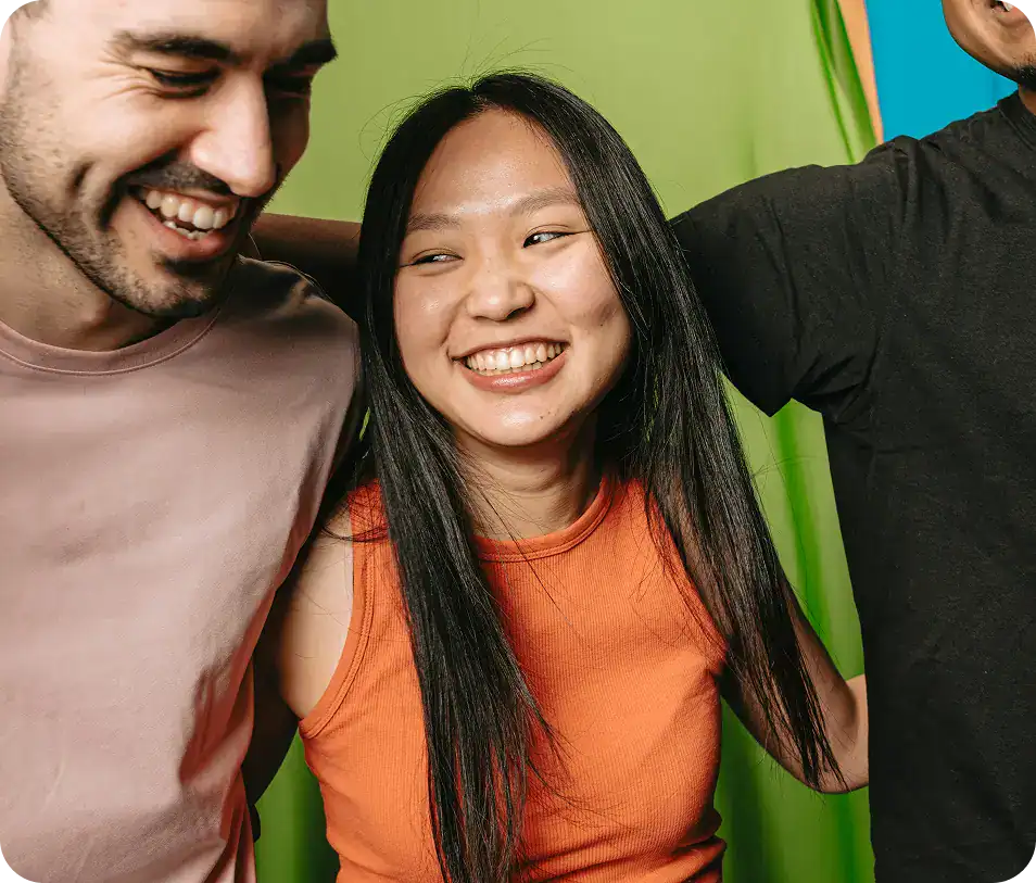 Group of friends embracing and smiling while celebrating recovery after cocaine addiction treatment in MA at Rebuilding Recovery Center.