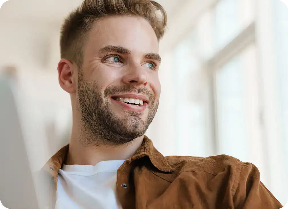 Smiling man representing hope and renewed well-being after benzodiazepine addiction treatment in Massachusetts at Rebuilding Recovery Center.