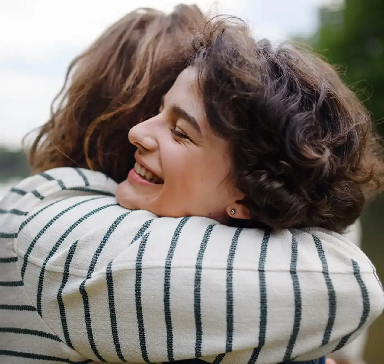 Woman reconnecting with a loved one after progress in Substance Abuse Treatment Programs in Massachusetts