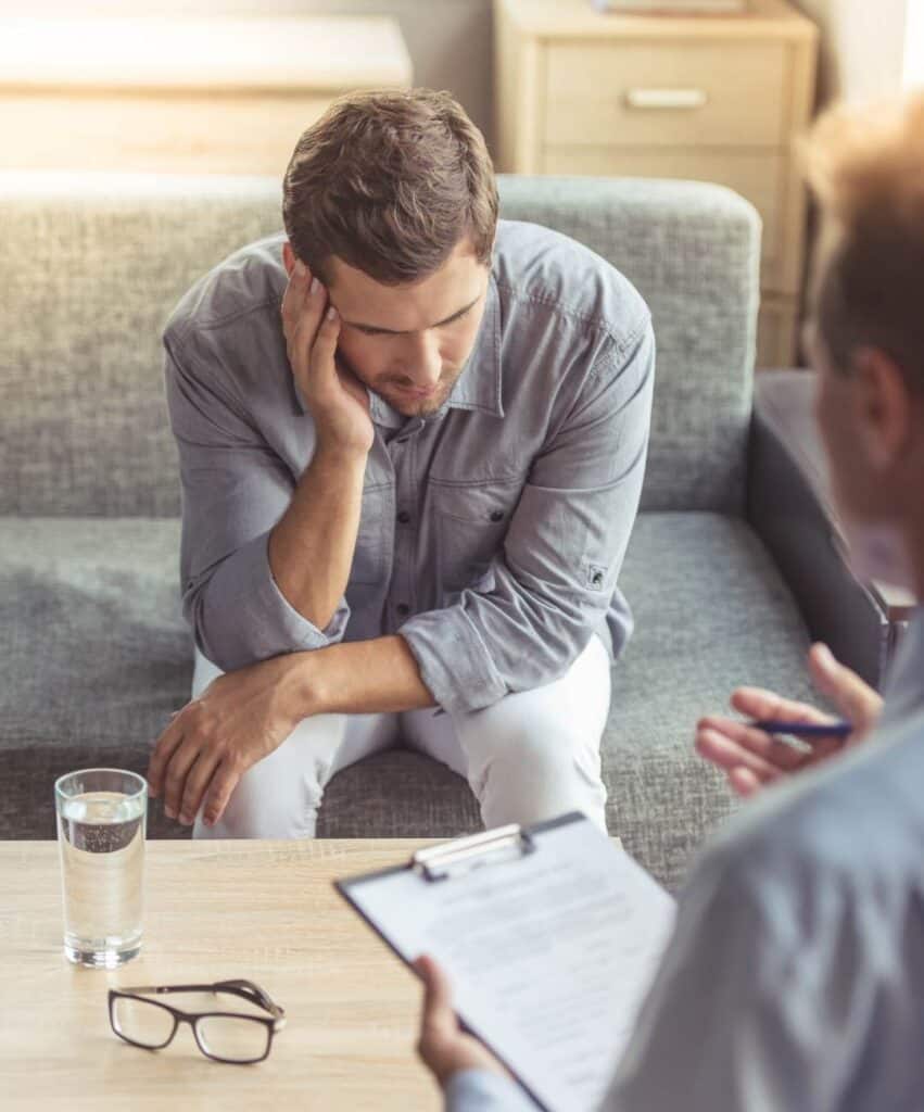Therapist working with a client during trauma counseling in MA.