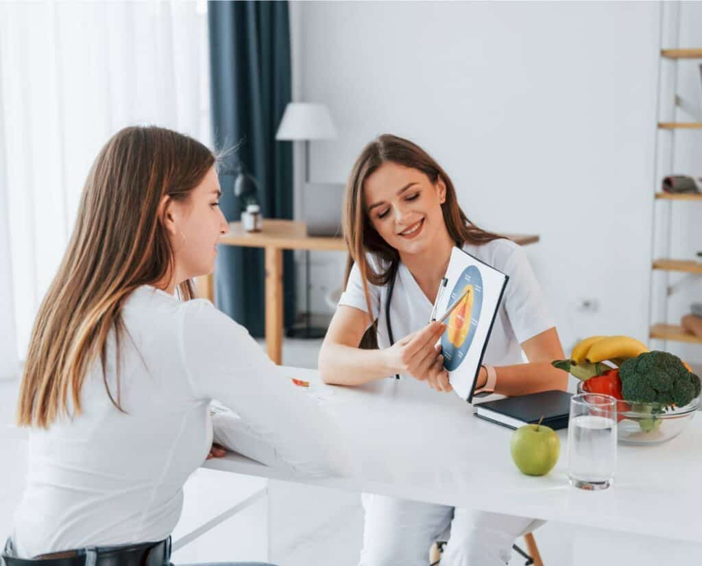 Woman learning about healthy nutrition through holistic therapies in MA.