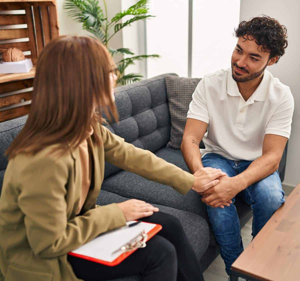 Therapist helping a client navigate trauma recovery through PTSD treatment in Massachusetts.
