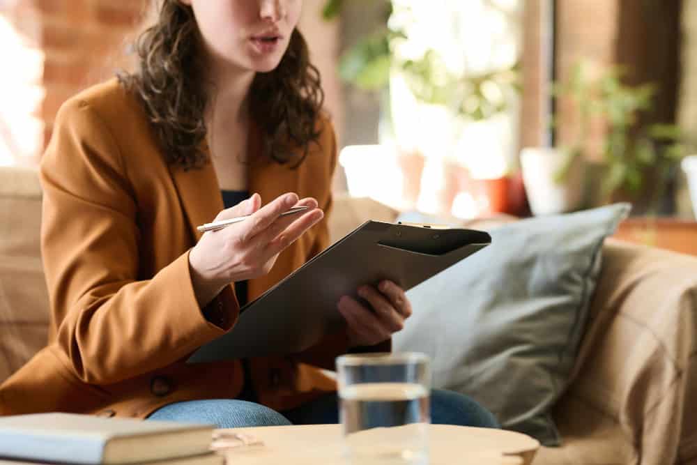 Young psychologist providing guidance during relapse prevention therapy in Easton, MA.