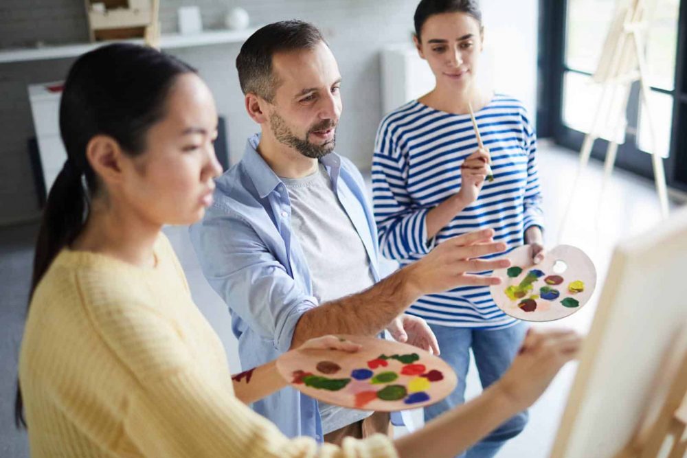 Expressive arts therapy for addiction in MA People working together during expressive arts therapy for addiction in MA.