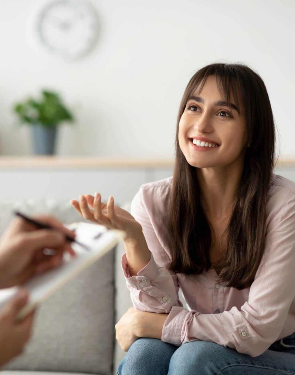 Woman speaking with a therapist during narrative therapy for substance abuse in MA.