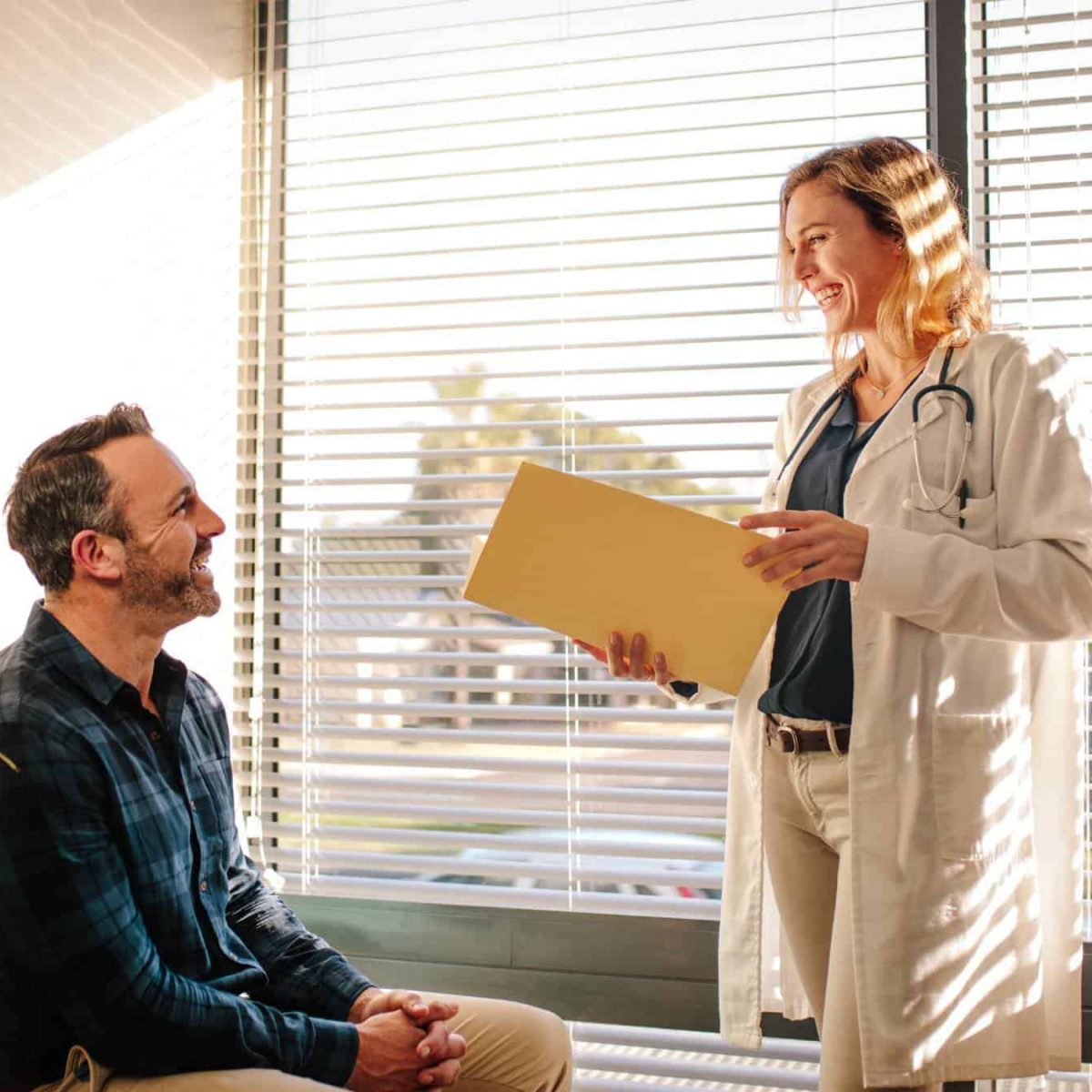 Doctor meeting with a man during a PTSD treatment appointment in Massachusetts.