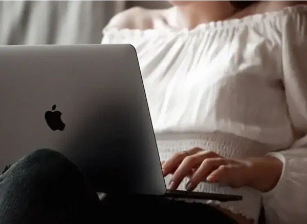 Woman on her laptop researching substance abuse treatment programs in Massachusetts.