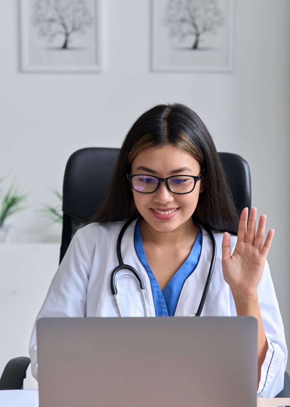 Clinician meeting with a patient through a laptop for virtual addiction treatment in Massachusetts.