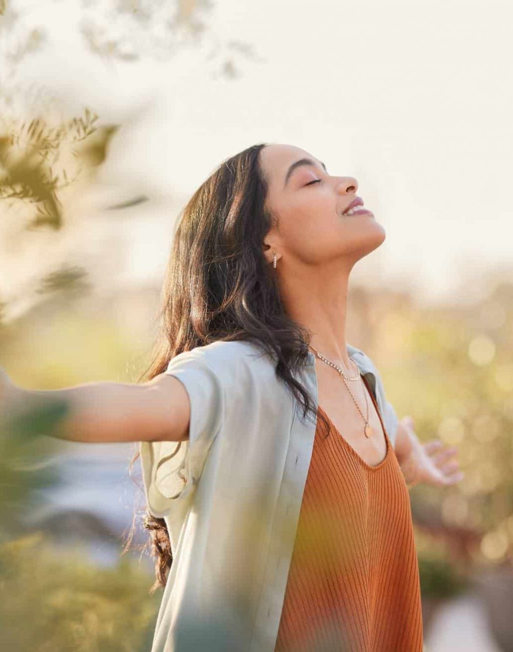 Woman enjoying a peaceful moment after holistic therapies in MA.